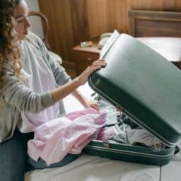 Woman with severe allergies packs for vacation.